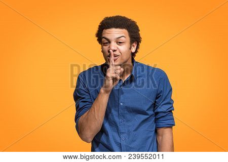 Secret, Gossip Concept. Young Man Whispering A Secret Behind His Hand. Businessman Isolated On Trend