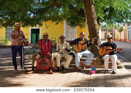 Trinidad, Cuba - 08 November 2016:  Latino American Men Of Musicians Play On Maracases, Guitar And S