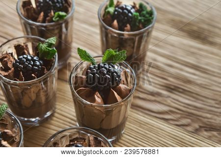 Chocolate Mousse In Glasses, Closeup. Desserts As Part Of Party Dessert Stand. Candy Bar And Caterin
