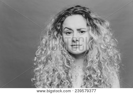 Young Attractive Woman Has Discontent Expression, Raises Eyebrow In Bewilderment, Being Dissatisfied
