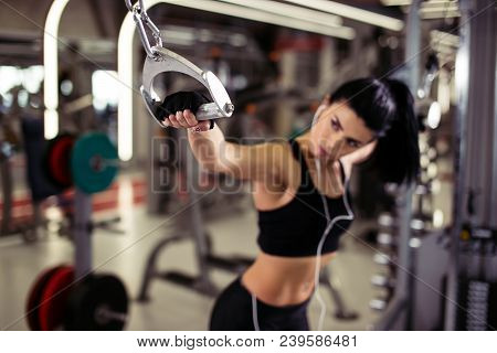 Fit Woman Exercise With Cable Crossover In Gym. Focus On Girl Hand. Selective Focus