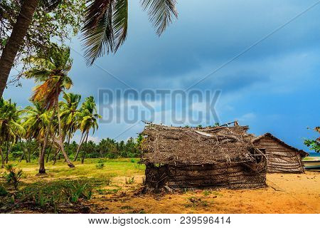 Thatched Coconut Leaf House Or Fishing Hut On Tropical Beach. Traditional Or Vintage Eco Friendly Ho