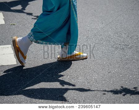 Woman Wearing Festive Japanese Tabi Socks With Sandals Marching Outdoors