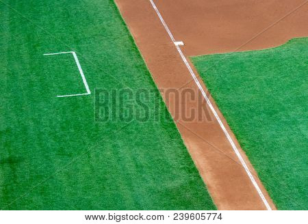 Empty Third Base And Coach Box Of A Baseball Diamond With Natural Grass