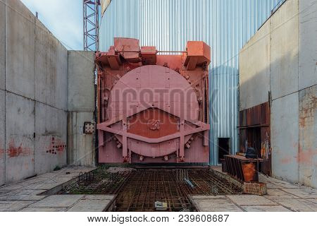 Red Metal Hermetic Gateway Door Of Airlock Of Nuclear Reactor Of Abandoned Unfinished Power Unit Of 