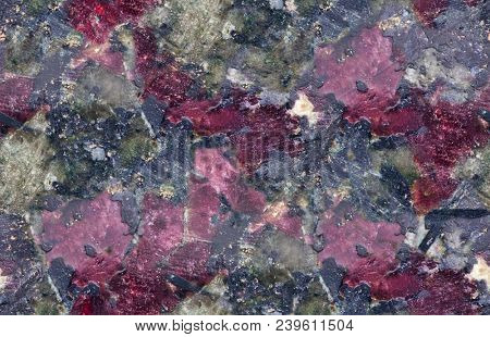 red and black eudialyte mineral seamless texture macro