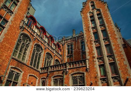 Brick Facade Of Buildings In Typical Flanders Style At Bruges. With Many Canals And Old Buildings, T