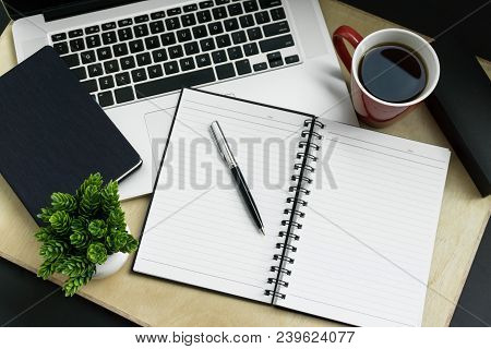 Assortment Of Multiple Home Office Supplies On Wood Background.