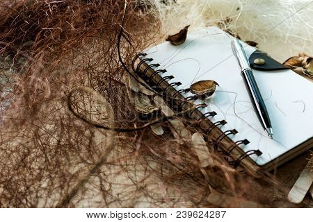 Spiral Notebook On A Background With Rustic Setup