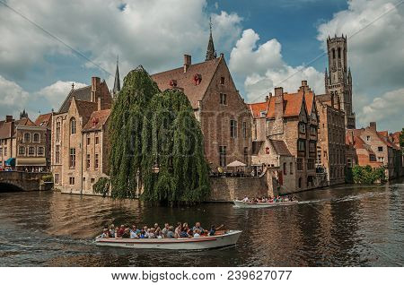 Bruges, Belgium - July 05, 2017. Boats And Old Buildings On The Canal Edge At Bruges. With Many Cana