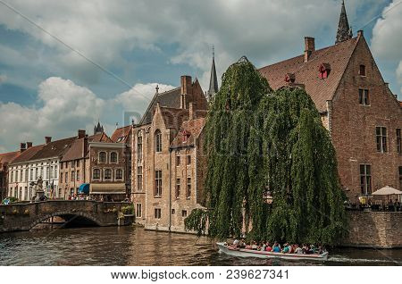 Bruges, Belgium - July 05, 2017. Boats And Old Buildings On The Canal Edge At Bruges. With Many Cana