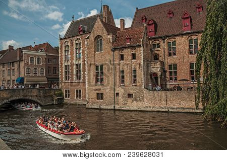 Bruges, Belgium - July 05, 2017. Boats And Old Buildings On The Canal Edge At Bruges. With Many Cana