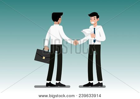 Two Businessmen Standing And Shake Hands Each Other For Cooperation And Make A Deal.