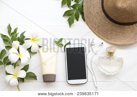 Natural Cosmetics For Skin Face Sunscreen Spf50 Whit Hat Mobile Phone And Perfume Of Lifestyle Woman