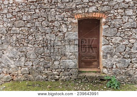 Very Old Weathered Brown Door Made Of Wood, Stone House (island Cres, Croatia)
