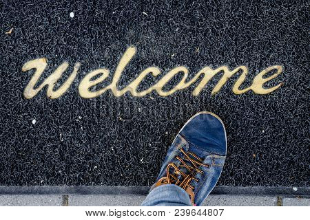 Leg Of  Man In Stylish Clothes Has Become On  A Rug With A Caption Welkome.  
Expression Of Hospital