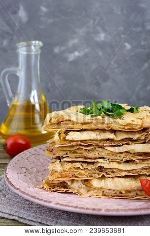 Pie, Casserole Pita With Mushrooms, Cottage Cheese And Cheese On A Plate On A Wooden Background. Lay