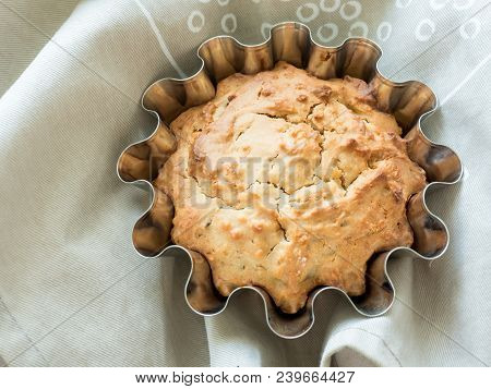 Home-baked Cakes On The Kitchen Table In The Baking Dish