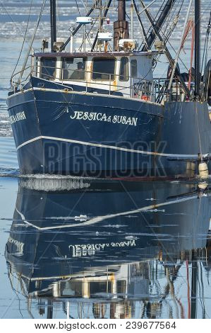 New Bedford, Massachusetts, Usa - January 10, 2018: Reflection Of Commercial Fishing Boat Jessica & 