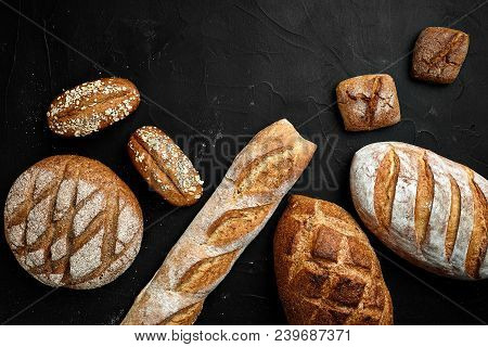 Bakery - Gold Rustic Crusty Loaves Of Bread And Buns On Black Chalkboard Background. Still Life Capt