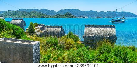 Panorama Of The Scenic Seascape With Yachts, Rocks And Lycian Tombs Of The Ancient Necropolis In Uca