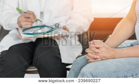 Doctor Or Psychiatrist Consulting And Diagnostic Examining Stressful Woman Patient On Obstetric - Gy