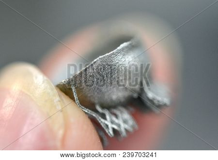 Small Object Printed On Metal 3d Printer Macro. Dental Crowns Created In Laser Sintering Machine Clo