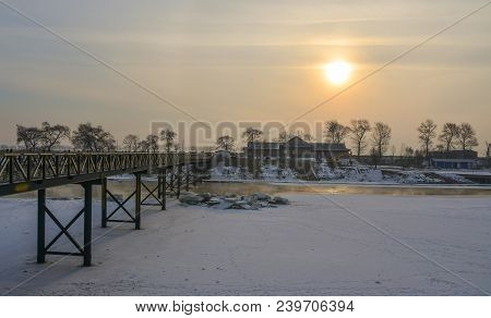 Harbin, China - Feb 25, 2018. Wooden Bridge Of Winter Park In Harbin, China. Harbin Is The Capital O