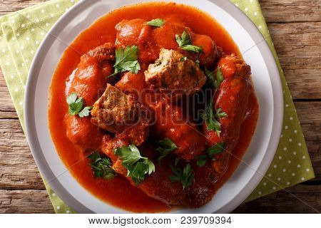 Italian Meat Roll Braciole Stuffed With Parsley And Cheese In Tomato Sauce Close-up. Horizontal Top