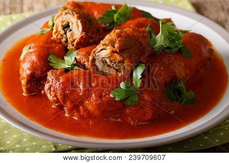 Beef Roll Stuffed With Parsley And Cheese Stewed In Tomato Sauce Close-up. Horizontal