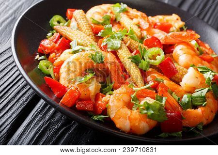 Shrimp With Bell Pepper, Chili, Garlic, Corn Cob And Herbs Close-up On A Plate. Horizontal