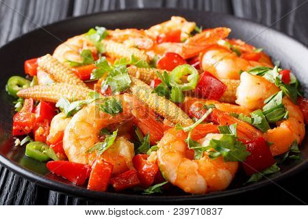 Mexican Delicious Prawns With Pepper, Garlic, Corn Cob And Herbs Close-up. Horizontal