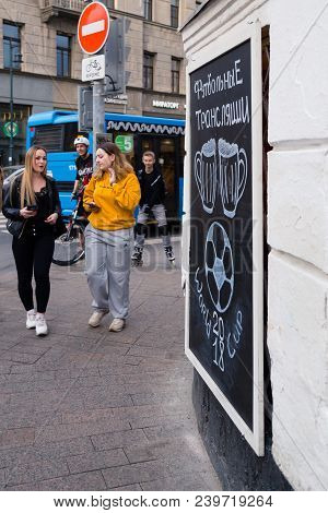 Moscow, Russia - April 30, 2018: People Near The Chalkboard On Solyansky Proezd With The Advertiseme