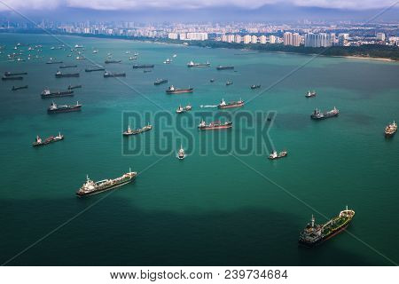 Top View From Airplane Of Singapore Harbor With Transportation Boat And Container Ship