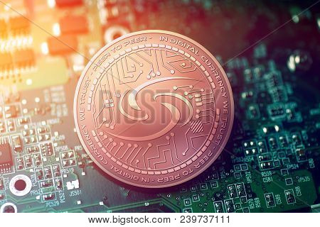 Shiny Copper Syscoin Cryptocurrency Coin On Blurry Motherboard Background Token