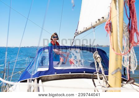 Young Man Sailing. Teenager Boy On Sea Sail Boat.