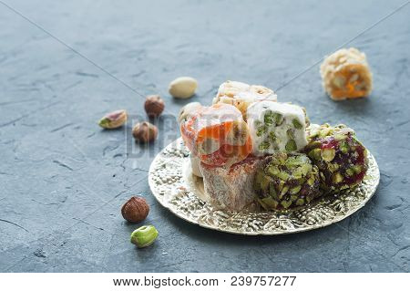 Oriental Sweets. Turkish Delight On A Gray Background. The View From The Top. Copy Space