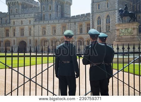 Windsor, Uk - May 5, 2018: Her Magesty Soldiers Walking Around The Castle On Duty. Windsor Castle Be