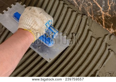 Close-up Of A Master's Hand That Makes Furrows In A Glutinous Solution