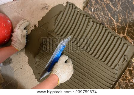 Close-up Of A Master's Hand That Makes Furrows In A Glutinous Solution