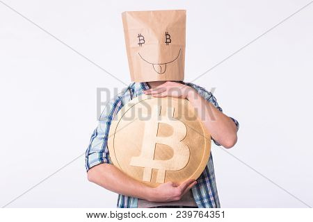 Golden Bitcoin In A Man Hand, Digitall Symbol Of A New Virtual Currency
