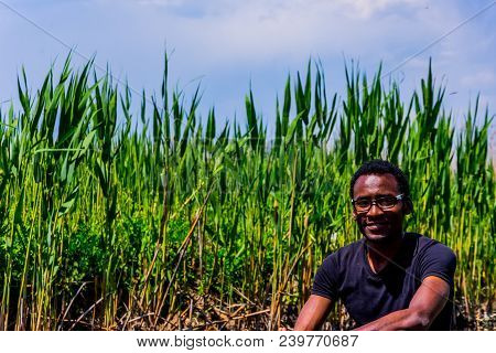 Young Black Man Posing On The Boat On The Eber Lake In Turkey. Eber Lake Is Located Between Two Turk