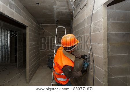 Slotting Of The Wall Under The Wiring With A Perforator.