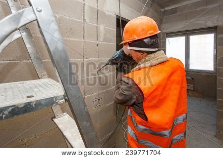 Slotting Of The Wall Under The Wiring With A Perforator.