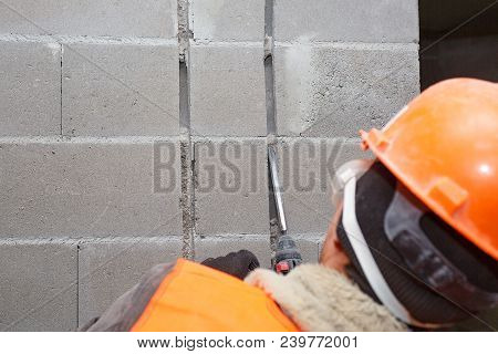 Slotting Of The Wall Under The Wiring With A Perforator.