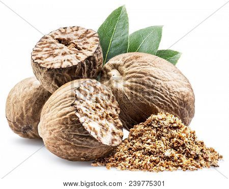 Dried seeds of fragrant nutmeg and grated nutmeg  isolated on white background.