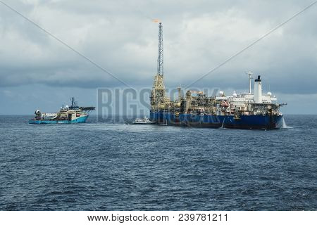 Dp Operations Near Fpso Tanker. Supply Fleet Job, Dsv Diving Support Vessel Is Approaching. Crewboat
