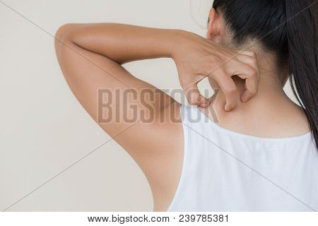 Close Up Woman Hand Scratch The Itch By Hand At Neck And Back. Healthcare And Medical Concept.