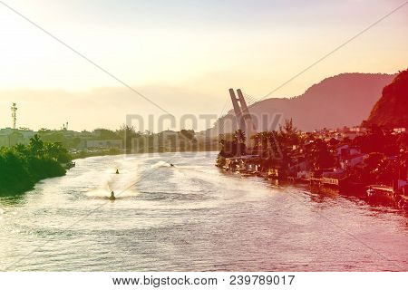 Marapendi Lagoon Seen From Above With Houses On The Hill During Sunset, Golden Light. Jet Skis Are R