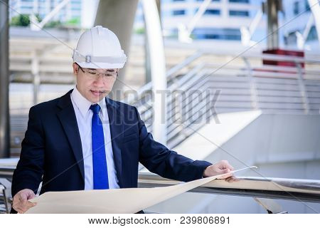 Asian Business And Engineer Man Has Planning And Working For Design Buiding And City.